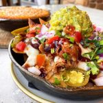 A southern and Mexican style salad full of guacamoe and veggies at Gus's BBQ restaurant in Claremont