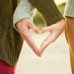 photo of hand holding forming a heart as a romantic thing to do in Claremont.